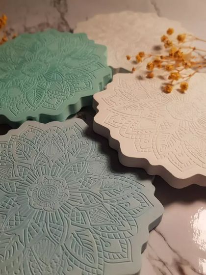 A closer look at the detailed pattern on our Mandala coasters. The design is pressed into the Jesmonite, creating a lovely textured surface.