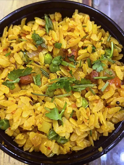 A close-up of my Veg Poha, packed with vegetables like peas and onions. It's a great way to start your day.