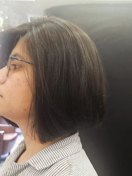 A side view of the classic bob, showing how it elegantly frames the face. This cut is versatile and effortlessly chic.