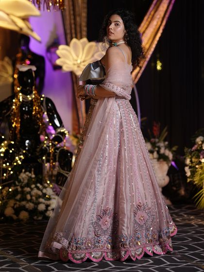 A full-length shot of my pastel lehenga, showing the intricate embroidery and the beautiful flare of the skirt. This highlights the craftsmanship of the outfit.