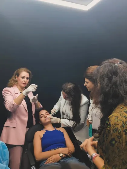 Continuous learning is essential in dermatology. Here I am at a training session for the launch of Juvederm Skinvive, staying updated on the latest techniques for skin hydration and glow. This ensures I can offer my patients the most advanced and effective treatments.
