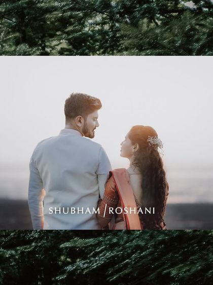 A romantic portrait of an engaged couple, capturing a quiet moment of connection against a natural, green backdrop.