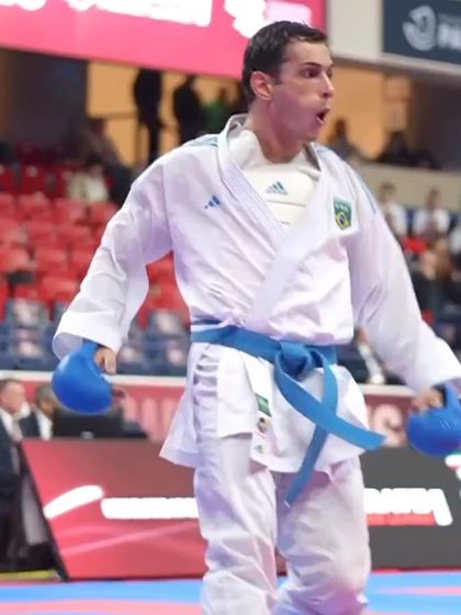 The raw emotion and focus of a competitor after scoring a point in a high-pressure match.