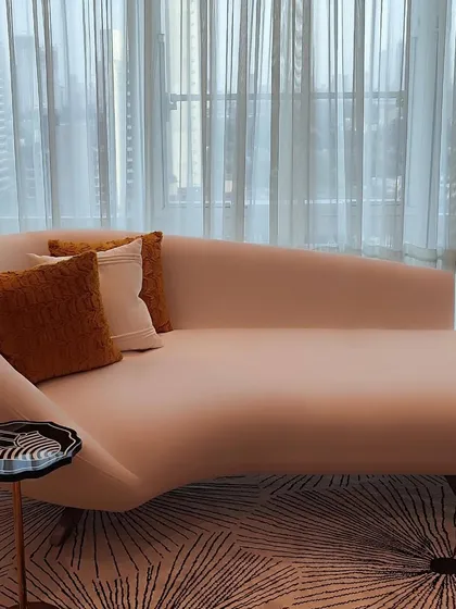 This bespoke chaise lounge embodies our philosophy of sculptural comfort. Its fluid, organic form provides an elegant focal point, while the plush upholstery invites relaxation, proving that true luxury lies in the perfect balance of form and function.
