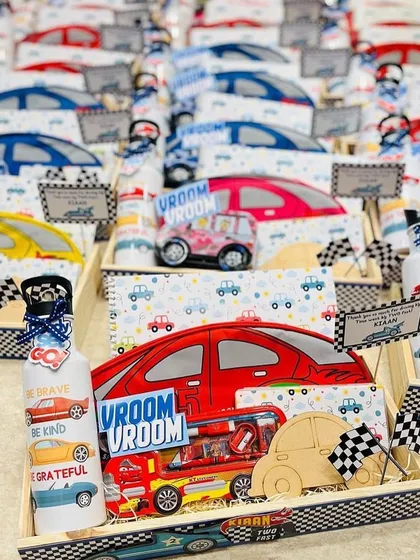 An army of car themed hampers ready for a birthday party. We can create these return gift sets in various colors and themes to match your event.