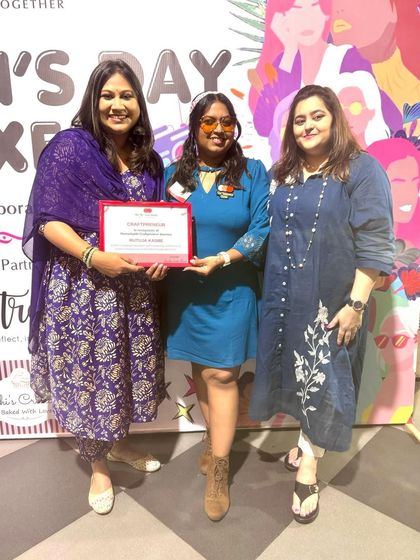 Receiving the award certificate. Thank you to everyone who has been a part of my journey and supported my small business.