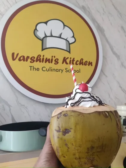 A creative coconut milkshake served in a natural coconut shell. This is a great example of the unique presentation ideas we share.