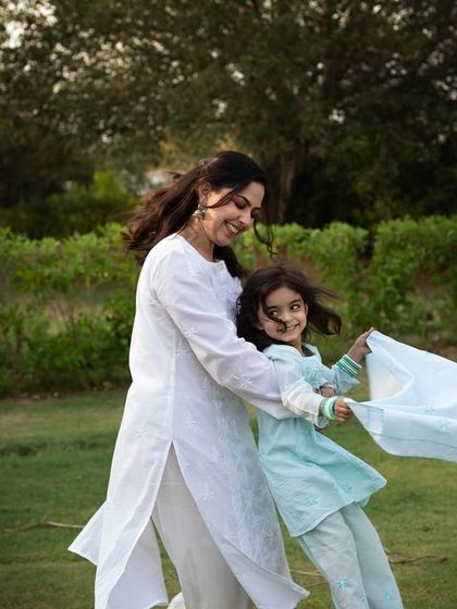 A playful spin in the park. These candid, action-filled shots are often the ones that best represent the energy and love within a family.
