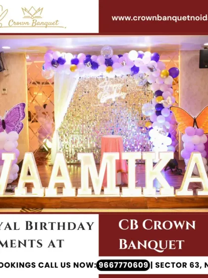 A royal butterfly-themed birthday decor. The large light-up name, sequin backdrop, and purple and orange butterfly accents create a glamorous and celebratory setting.