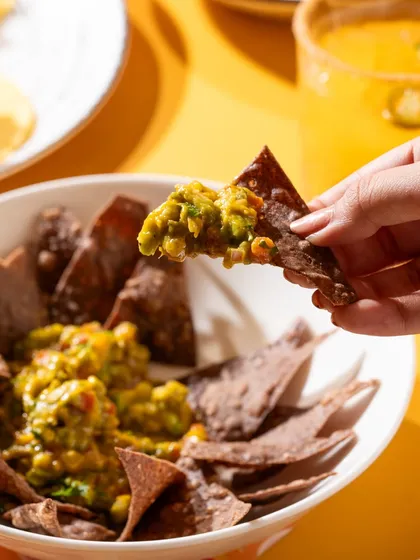 Chips and mango guacamole, a fun twist on a classic dish for a seasonal menu.