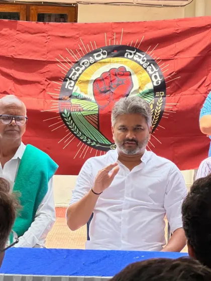 A candid moment of discussion during a community meeting. Listening intently is as important as speaking, and it is through these interactions that we find collective solutions.
