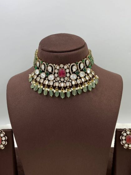 A close-up of our versatile floral stud earrings. These are available in multiple colors like emerald green and ruby red, and can be paired with many different necklaces.