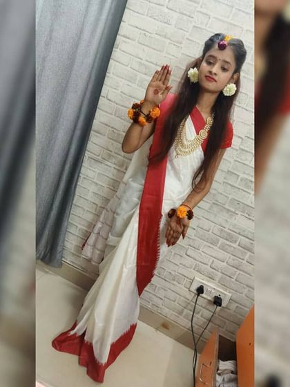 This pose captures the grace of the traditional look created by our beauty culture student. It’s a testament to how our courses help students understand and execute culturally specific makeup styles.