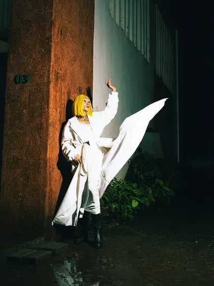 The drama of a flowing white coat captured with a flash at night. This image plays with light and shadow to create a sense of movement and power in a static photo.