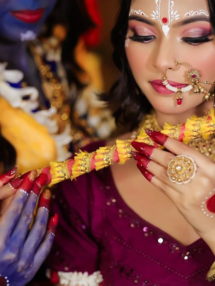 A detailed shot of the hands and flute, highlighting the nail art and jewelry.