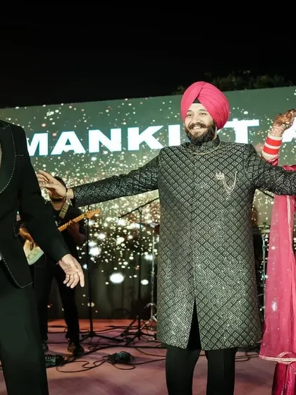 The couple dances on stage with singer Mankirt Aulakh, a truly memorable highlight of their wedding.