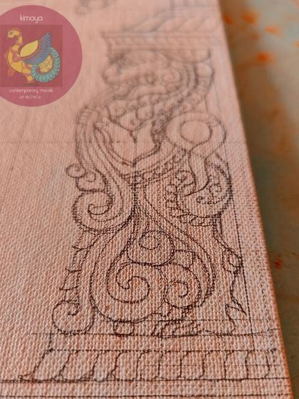 A close-up of the intricate 'yali' figure sketched on the pillar of the Hanuman painting.