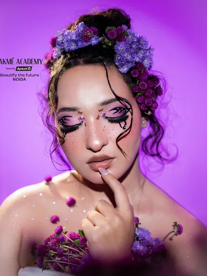 A close-up of the floral fairy makeup. The faux freckles and shimmering skin add to the ethereal quality of this beautiful student creation.