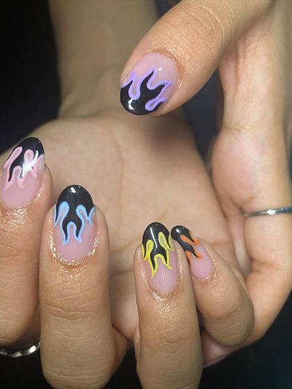 This set shows how versatile flame nail art can be, with a mix of yellow, blue, and purple flames for a super fun look.