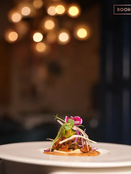 This is my Uttapam Taco, a playful fusion where South Indian tradition meets a global favorite. It’s a perfect example of how I reimagine desi flavours, served here against the warm, elegant backdrop of our dining room.