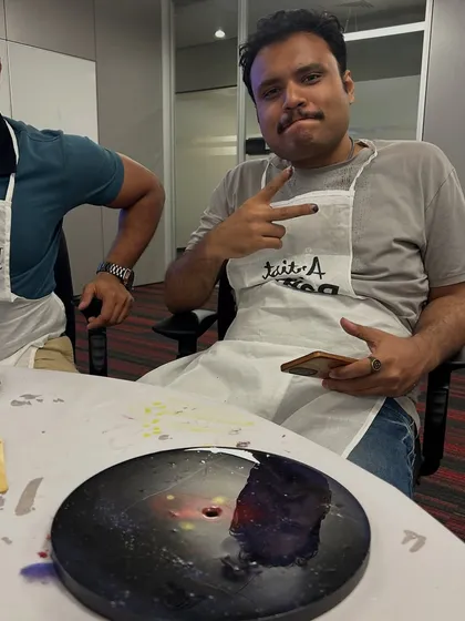 A member of the NetApp team having fun during the resin clock workshop. Our events are low-pressure and focused on enjoyment.