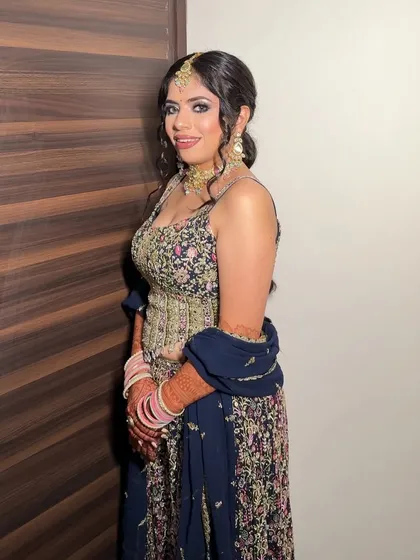 My bride Chandni, looking radiant for her Mata ki Chowki. We created a soft glam look with a focus on her eyes to complement her heavily embellished outfit.