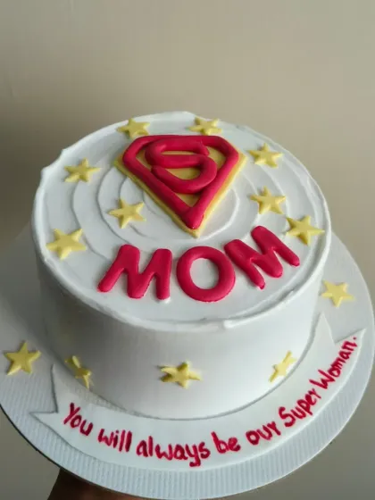 Show your mom she's a superhero with this "Super Mom" themed cake. It features the iconic 'S' symbol and a message that she will always be your Super Woman.