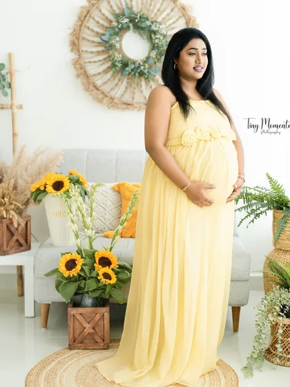Bathed in the soft, natural light of my studio, this portrait is all about pure joy. The boho-inspired setting with bright sunflowers creates a warm, cheerful atmosphere to celebrate your sunny glow.