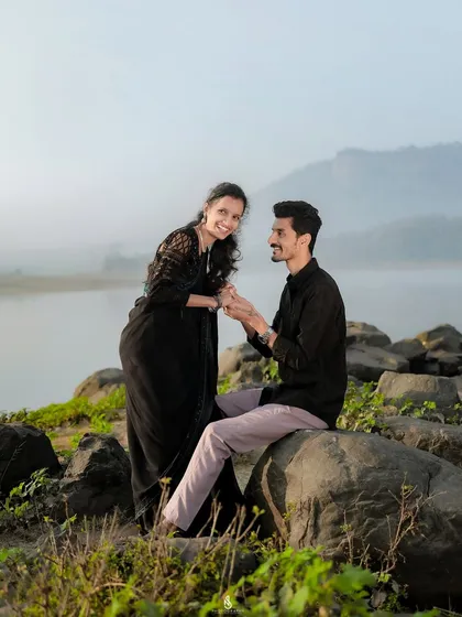 A playful interaction on the rocks by the lake. Even in quiet settings, we can capture moments of fun and laughter.