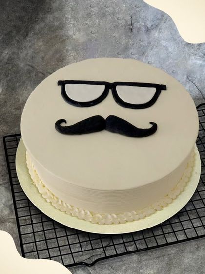 A classic and cool mustache and glasses cake. This dapper design is perfect for celebrating a gentleman's birthday in style.