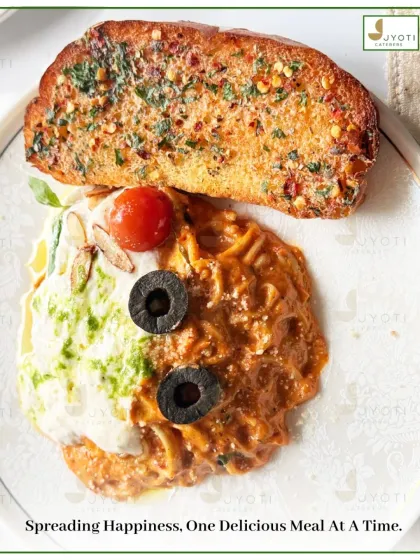 Spreading happiness, one delicious meal at a time. This plate features a duo of pastas, one with a creamy pesto sauce and the other with a rich tomato sauce, served with garlic bread.