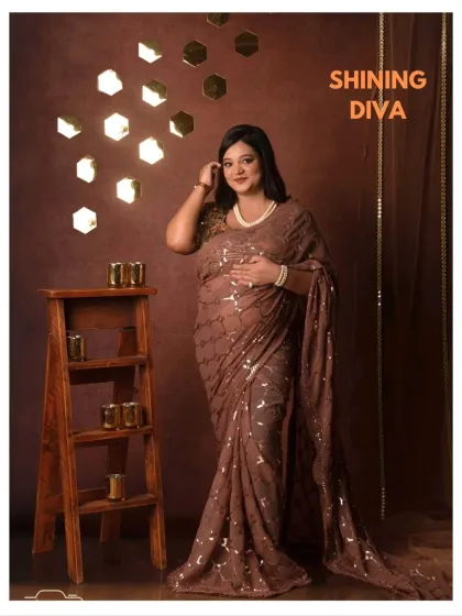 A modern take on traditional wear. This "Shining Diva" setup with a sequin saree is for the mama who loves glamour.