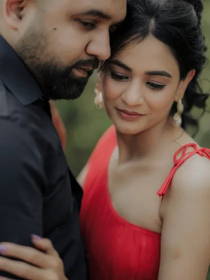 A quiet moment of togetherness. The woman rests her head on her partner's chest, her eyes closed in contentment, perfectly capturing the feeling of safety and love.