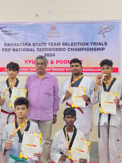 A group of our male athletes proudly displaying their medals and certificates after the Karnataka State Team Selection Trials. Their hard work has paid off.
