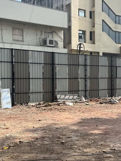 The 'Dream City Chambers' site secured and ready for excavation. The temporary fencing marks the boundary of a complex project that required extensive planning, including site edge piling for the two-level basement.
