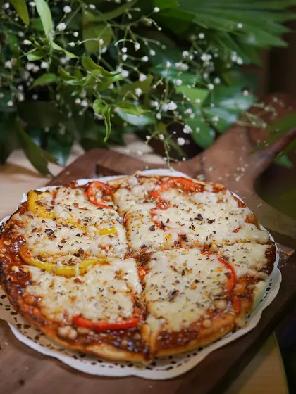 A classic cheese pizza with bell peppers, perfect for casual events or as a kid-friendly option.