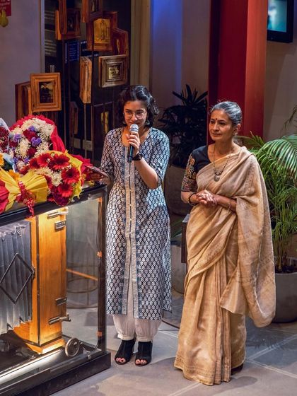 My student Ishana, who also helped emcee the event, standing with my mother. It is wonderful to see students take on leadership roles.