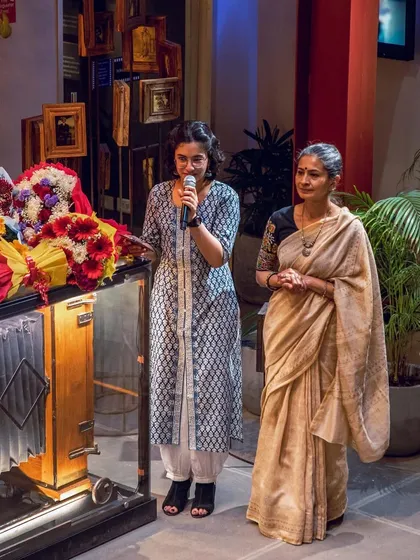 My student Ishana, who also helped emcee the event, standing with my mother. It is wonderful to see students take on leadership roles.