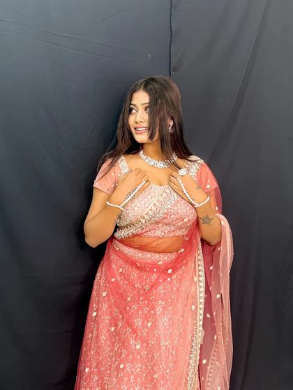 Slaying! Another shot of our happy client looking fabulous in a pink rental lehenga and sparkling diamond jewellery set from our collection.