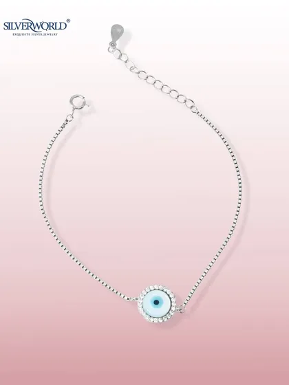 Our classic evil eye bracelet, featuring a single charm with a zirconia halo on a delicate box chain. This piece is crafted for style and subtle strength.