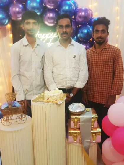 The birthday boy, Shivamogga Tahsildar Mr. Pradeep, posing with his friends in front of the custom decoration I arranged for his party.