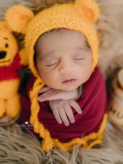 A little bundle of joy straight from the Hundred Acre Wood. This 7-day-old newborn is the cutest Pooh bear I've ever seen.