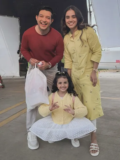 A happy moment on set with my on-screen family for a commercial shoot. Working with other actors, especially kids, requires a positive and patient attitude, which I always bring to the set. It's all about creating a believable and cheerful family dynamic.