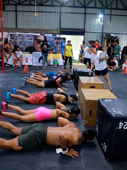 Athletes tackling synchronized push-ups during a team workout. Competition here is not just about individual strength but also about working together seamlessly.