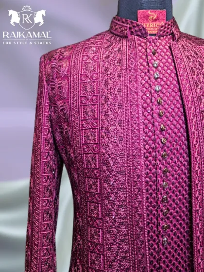 A close-up of the intricate embroidery and button placket of the magenta Jodhpuri, showing the level of detail in my craft.