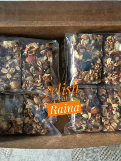 My Granola Bars made with dates as a natural sweetener. These are packed with rolled oats, various nuts, seeds, and dried fruits like cranberries and pineapple.