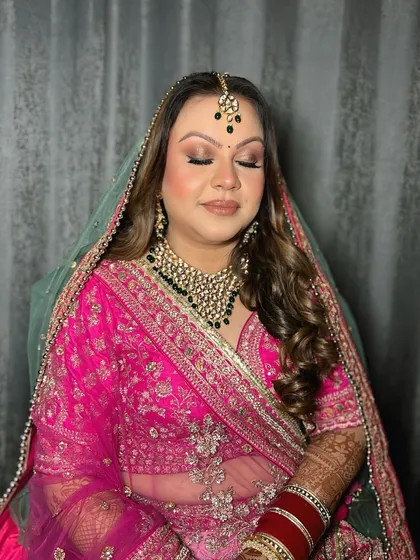 A detailed shot of the eye makeup for this bridal look. The blend of neutral shimmers and a sharp liner creates a sophisticated yet glamorous effect.
