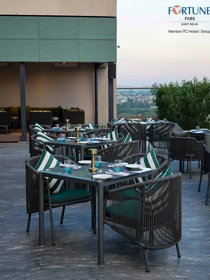 The contemporary wicker chairs and clean lines of our furniture provide a sophisticated yet comfortable dining environment at Nakshatra.