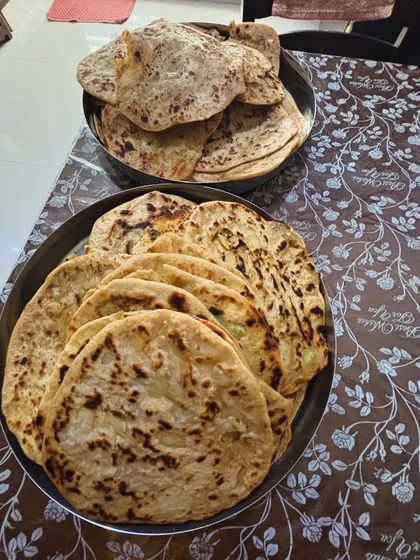 For a large party order, I single-handedly prepared 100 fresh, hand-rolled stuffed parathas. I take pride in managing large-scale catering orders myself to guarantee consistent, homemade quality in every single dish.