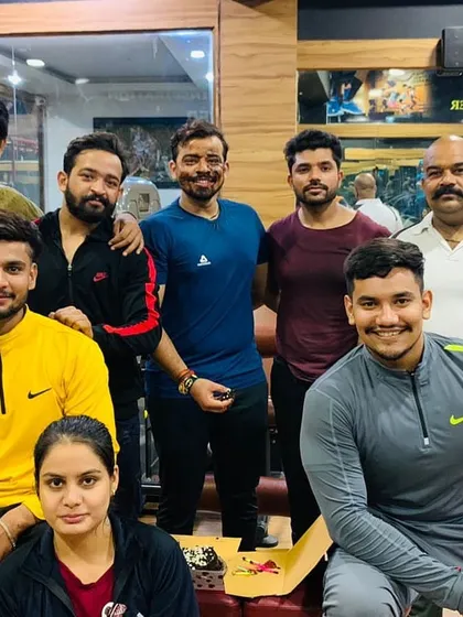 The whole team, trainers and members, coming together for a picture. This supportive atmosphere is what makes people feel at home and stay motivated on their fitness journey.
